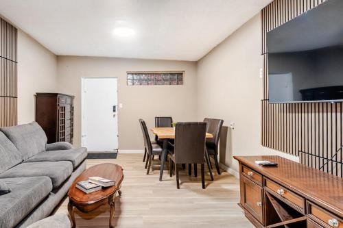 a living room with a couch and a table at Great 1BR Apartment near VIA Rail in London