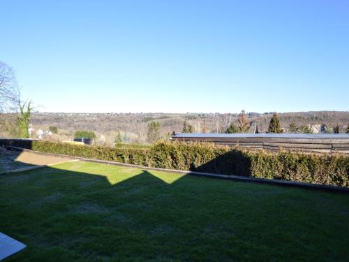 a garden with green grass and a building at Luxurious Cottage in Aywaille with Sauna in Aywaille