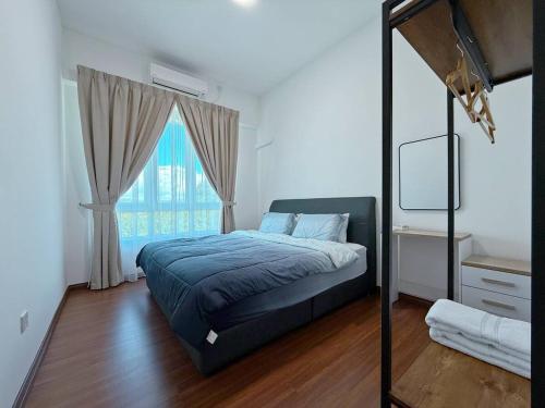 a bedroom with a bed and a large window at Sri Indah The Eleventh 5pax in Sandakan