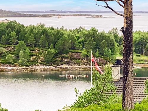 a view of a body of water with a flag at 6 person holiday home in Aure-By Traum in Aure