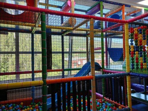 a playground with a bunch of different colored play equipment at Ośrodek Wypoczynkowy Zapalenica in Szczyrk