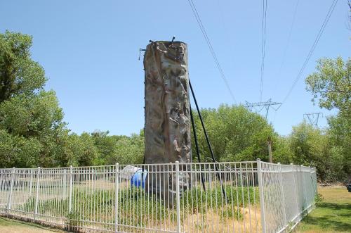 a climbing ape in a playground behind a fence at Soledad Canyon Cabin 18 in Ravenna