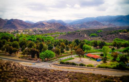 an aerial view of a park with mountains in the background at Soledad Canyon Cabin 18 in Ravenna