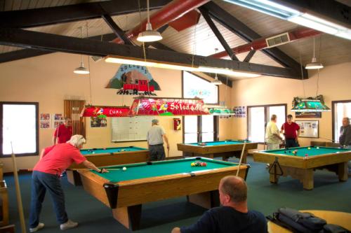 a group of people playing pool in a room at Soledad Canyon Studio Cabin 19 in Ravenna