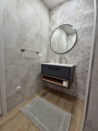 a bathroom with a sink and a mirror at New Villa Penelopa in Babino Polje