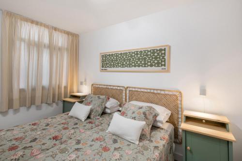 a bedroom with a bed with two pillows at Naos Suite in Puerto Naos