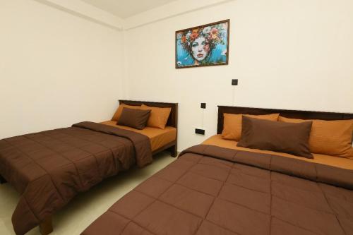 バンダーラウェラにあるElla 420villaの部屋に並んで置かれた2つのベッド