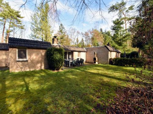 an exterior view of a house with a yard at Holiday Home in Lochem near Forest Trails in Lochem