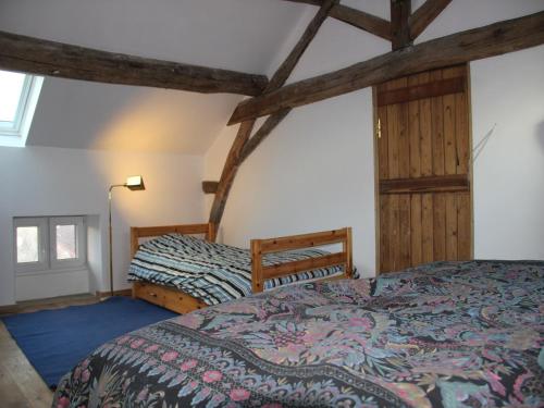 a bedroom with two beds in a room at Villa with Spa & Pool in Villiers-les-Moines