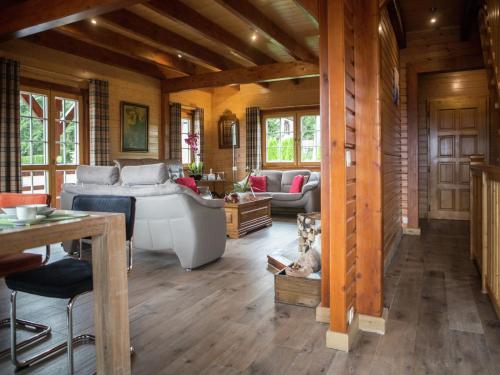a large living room with a tub and a couch at Luxury Wellness Villa, Septon in Durbuy