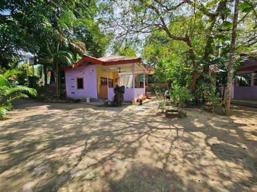 a small house in the middle of a yard at Havelock Harmony- Havelock Island in Havelock Island