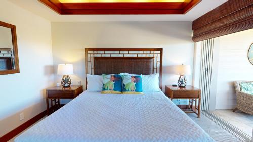 a bedroom with a large bed with two night stands at COCONUT TELEGRAPH Rejuvenating 3BR Villages Home Near Recreation Center in Waikoloa