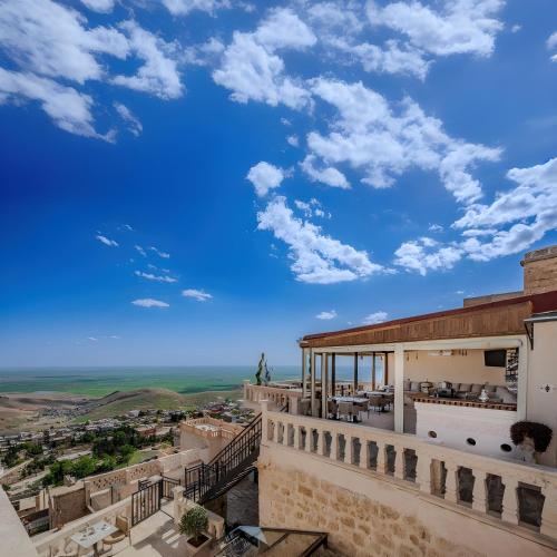 a view from the balcony of a building with a blue sky at Maran House Mardin in Mardin
