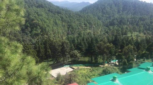 an aerial view of a mountain with a swimming pool at Luxury Royal Penthouses in Bhowāli