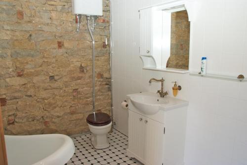 a bathroom with a toilet and a sink at Kreutzhouse in Haapsalu