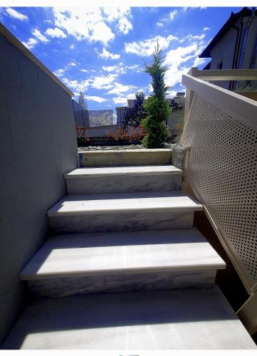 a set of stairs leading up to a building at Olea Luxury Suites in Asprovalta