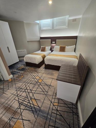 a room with two beds and a table in it at KGT House in Dublin