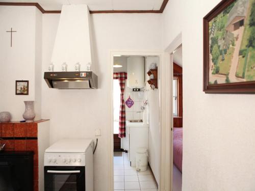 a kitchen with a sink and a stove top oven at Holiday Home in Margraten near Maastricht in Margraten