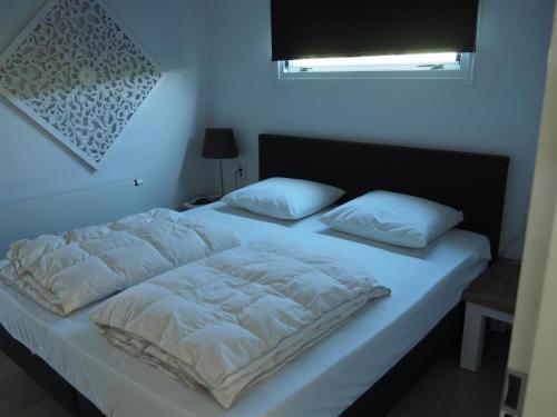 Ένα ή περισσότερα κρεβάτια σε δωμάτιο στο Holiday Home in Kattendijke near Oosterschelde