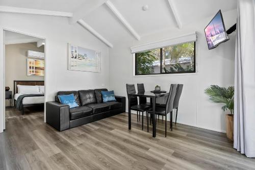 a living room with a couch and a table at Ingenia Holidays Kinka Beach Yeppoon in Kinka