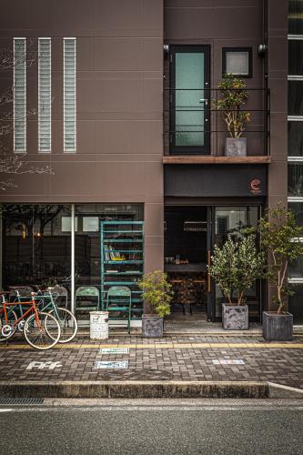 a group of bikes parked in front of a building at The EKAI in Toyohashi