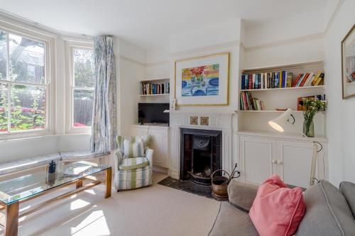 a living room with a couch and a fireplace at 3 Bed in Aldeburgh oc-f32700 in Aldeburgh