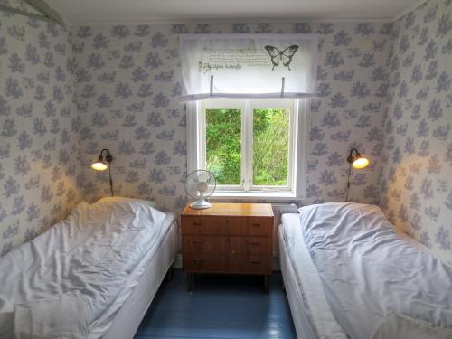 En eller flere senge i et værelse på ÖlandsRo B&B
