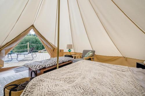 a room with a tent with two beds and a table at 1 Bed in Austwick oc-r32793 in Eldroth