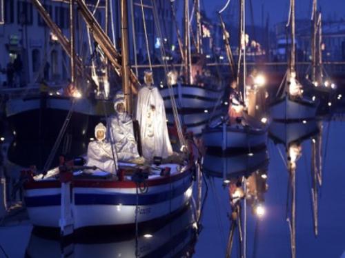 a group of people sitting on a boat in the water at Miramare in Cesenatico