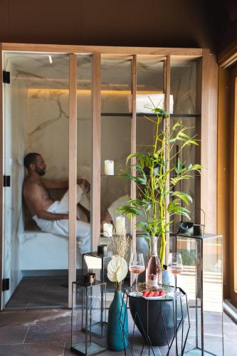 a man sleeping in a bed in a room at IL Pollaio in Farra di Soligo