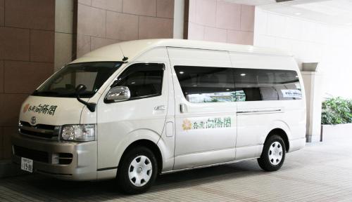 a white delivery van parked in a building at Hyoe Koyokaku in Kobe