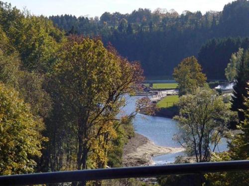 a view of a river in the middle of a forest at Scenic chalet in Vieuxville with terrace in Vieuxville