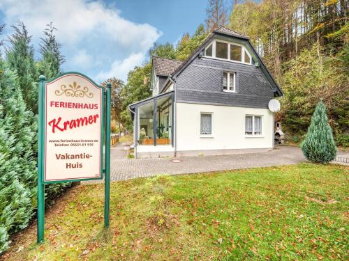 a house with a sign in front of it at Deluxe Holiday Home in Brilon-Wald near Ski Area in Brilon