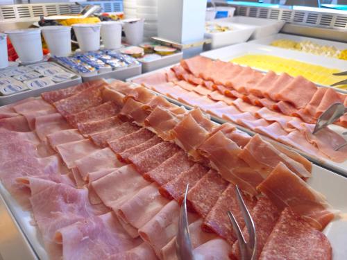 a buffet with many different types of food on display at Hotel Delle Nazioni - Adults Only in Caorle