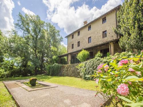 an external view of a building with a garden at Unique country house in an old hamlet in Monte Castelli