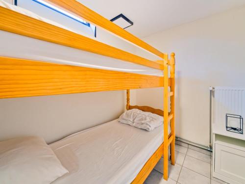 a bedroom with two bunk beds and a window at Test Property Sophisticated Holiday Home in Lierneux near forest in Lierneux