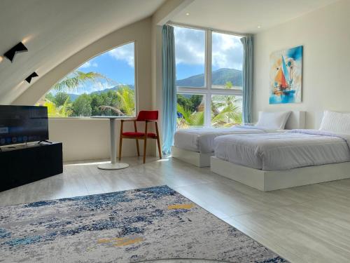 Ένα ή περισσότερα κρεβάτια σε δωμάτιο στο Narayana Hotel Karimunjawa