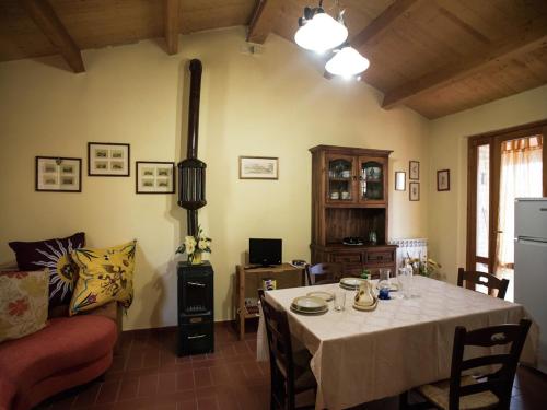 a living room with a table and a couch at Holiday Home in Paciano with Swimming Pool,Terrace,Billiards in Paciano