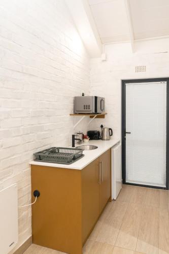a kitchen with a sink and a counter top at Rouana Guest Farm in Stellenbosch