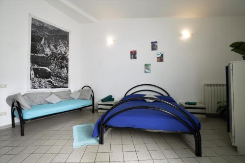 a room with two beds in a room at U Ciousu by Ligurian Life APPARTAMENTI IN AGRITURISMO in Vallebona