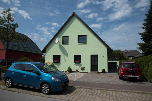 a blue car parked in front of a house at Annabell in Kühlungsborn