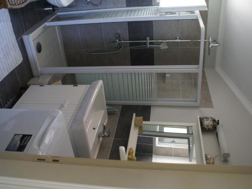 a bathroom with a sink and a bath tub at Holiday Home with Garden in Kritinia in Kritinía