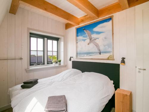 Ένα ή περισσότερα κρεβάτια σε δωμάτιο στο Spacious holiday home Hazenborgh in Callantsoog near beach