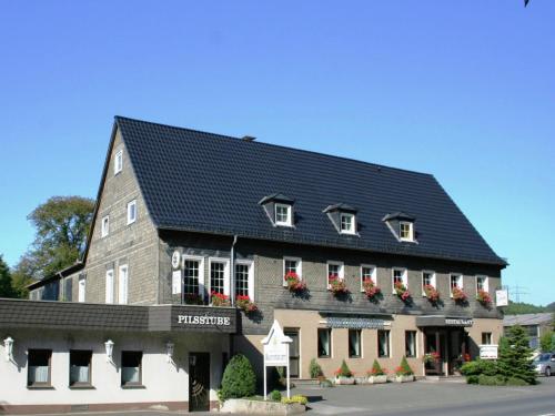 a rendering of a building with a black roof at Apartment near ski area in Wehrstapel in Sauerland in Meschede
