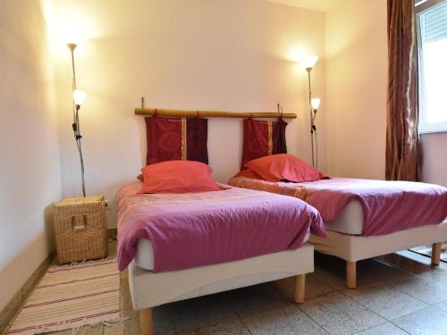 two beds sitting next to each other in a bedroom at Holiday home with beautiful view on the village in Varsberg