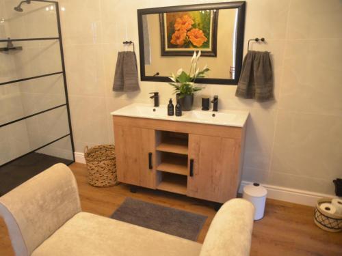 a bathroom with a sink and a mirror at Fiore Guest Accommodation in Greyton
