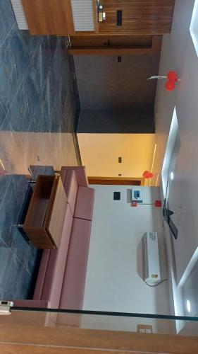 an overhead view of a kitchen with a refrigerator at Hotel Heritage Inn in Mahesāna