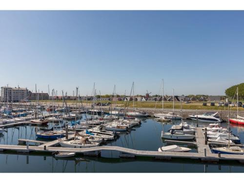a bunch of boats docked in a harbor at Unique apartment, located on the Oosterschelde and marina of Sint Annaland in Sint Annaland