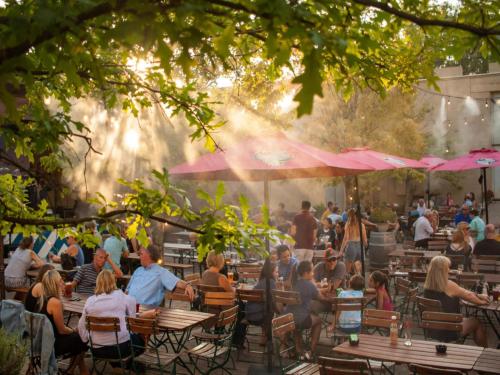a group of people sitting at tables in a restaurant at Holiday House in Szczecin at the lake with parking space for 4 persons in Szczecin