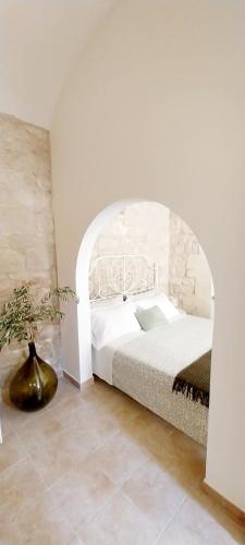 Ένα ή περισσότερα κρεβάτια σε δωμάτιο στο Tirella Home